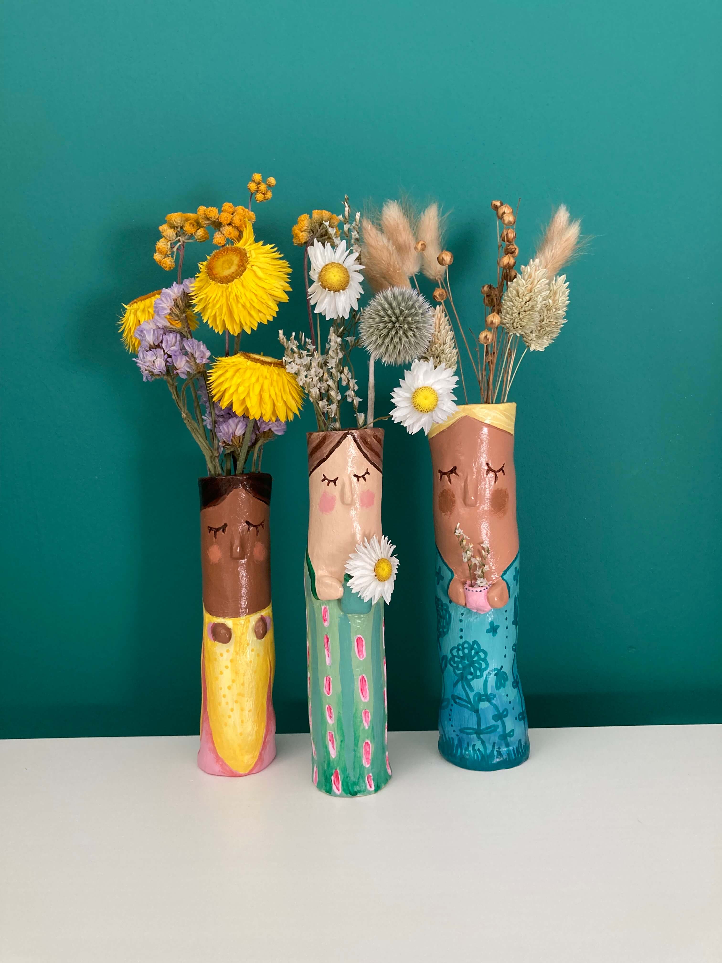 Character Face Vases crafted using pottery kit