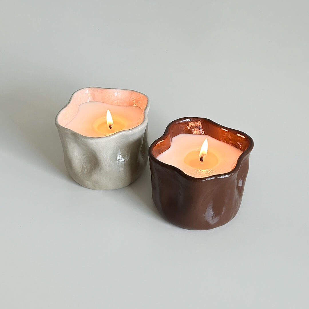 Artfully dented handmade candles in pastel hues