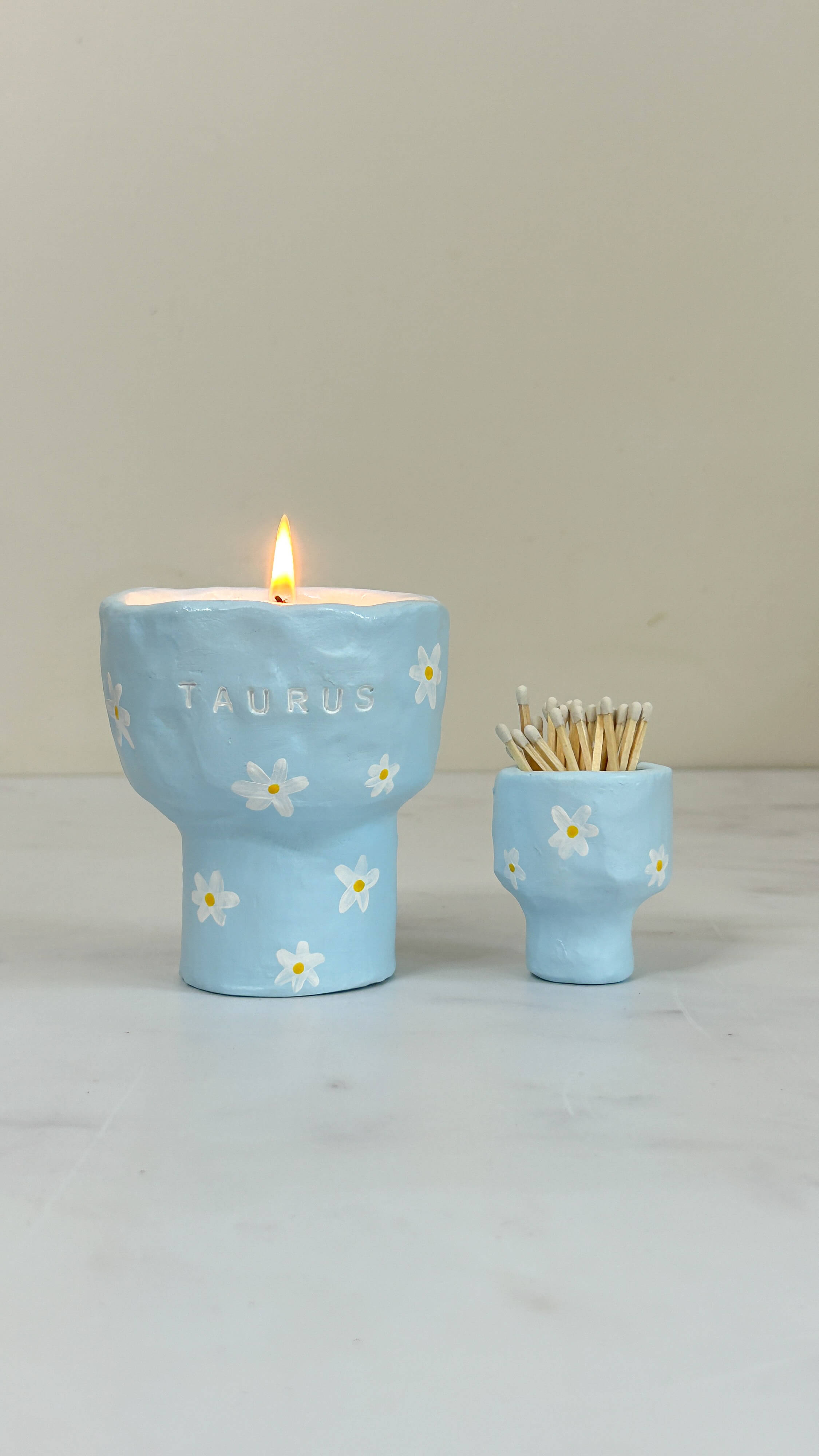 Zodiac-themed handmade candle in ceramic jar